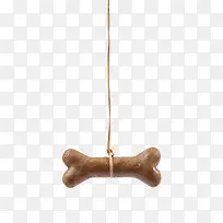 棕色可爱动物的食物吊着的骨头狗