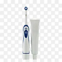 白色包装的牙膏管和电动牙刷实物