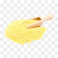 黄色小米粒堆木质铲子