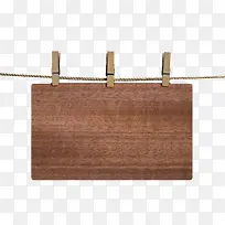 用夹子夹在绳子挂着的木板实物