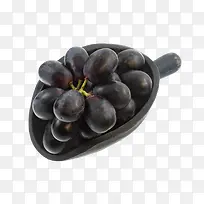 黑陶勺子里的黑色葡萄