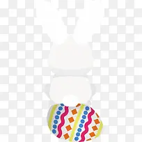 复活节坐在彩蛋上的兔子