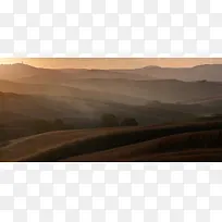 夕阳下的连绵山峦海报背景