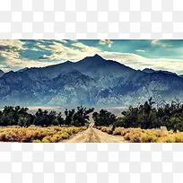 高山蓝天白云树林大道摄影