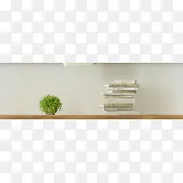 书本绿色植物灰色墙面高清摄影