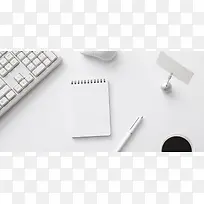 白色办公桌笔记本海报背景