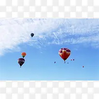 蓝色天空中的彩色热气球海报背景