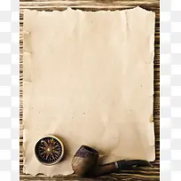 纸张上的烟斗和指南针