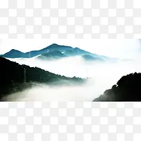 云雾遮挡的山峦海报背景