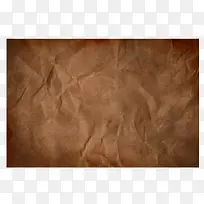 深棕色牛皮纸褶皱纹理背景
