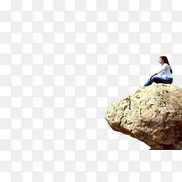 坐在岩石上的女性