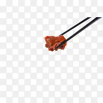 筷子夹着红烧肉