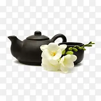 黑色的茶壶和茶杯泡茉莉花茶