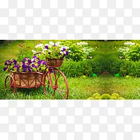 花园中满载花朵的自行车摄影海报背景图片