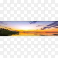 日落芦苇湖面风景背景